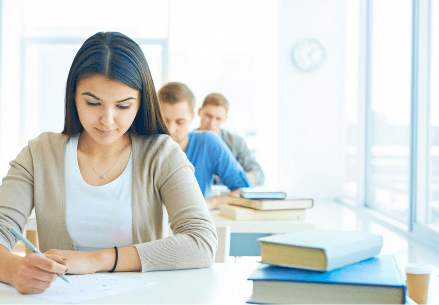 student doing an exam in a classroom